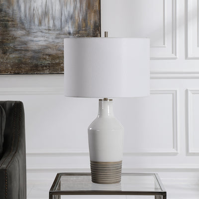 This Ceramic Lamp Features A White Crackle Glaze Finish Paired With A Ribbed Textured Bottom Half Finished In An Aged Terr...