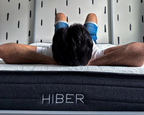 Man laying on HIBER mattress.
