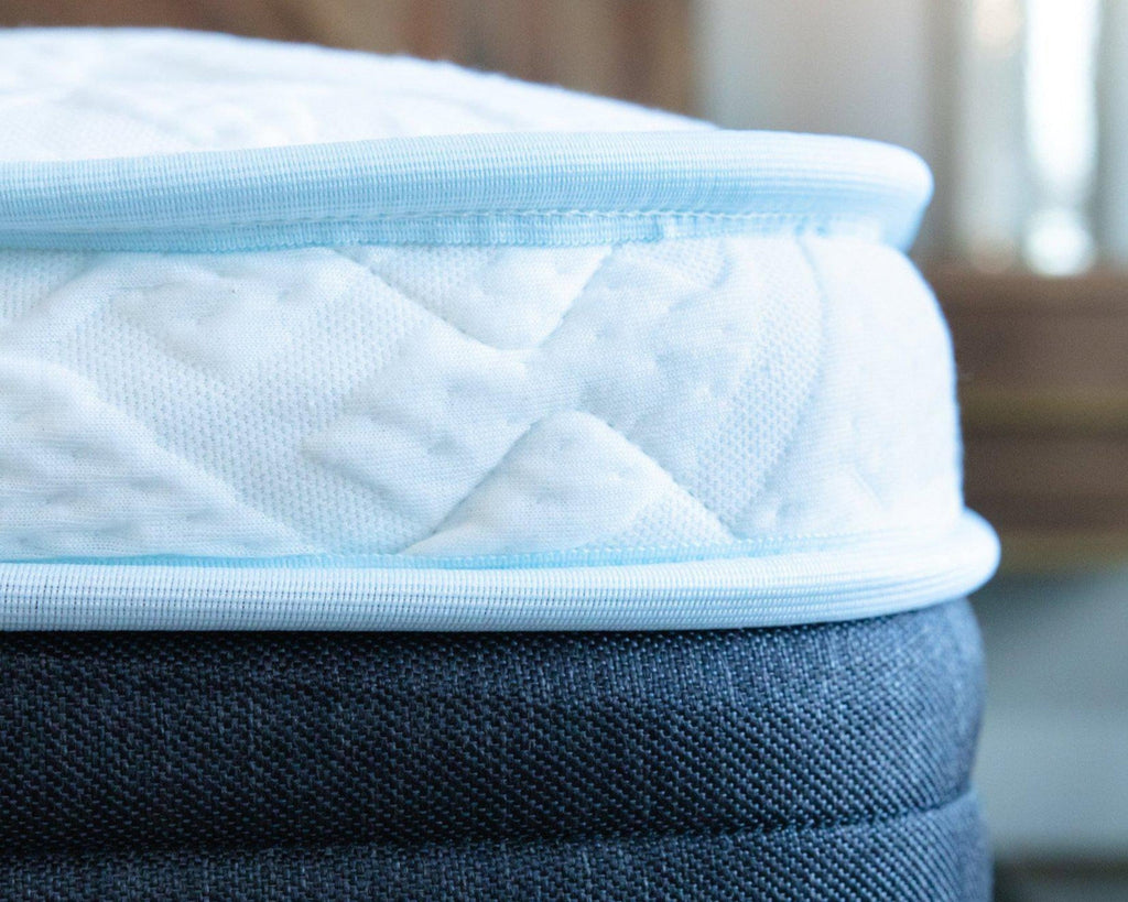 Close-up of the 12" Haven Eurotop Hybrid mattress edge, featuring reinforced perimeter support for enhanced durability and stability, preventing sagging and extending mattress lifespan and handmade craftsmanship.