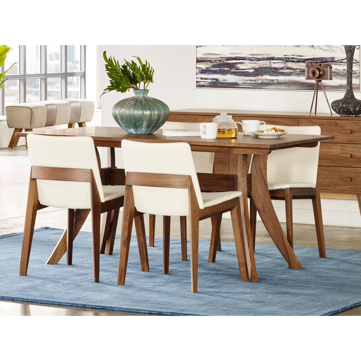 The Florence Dining Table's simple and elegant mid-century design creates a seamless transition into any dining space. Mad...