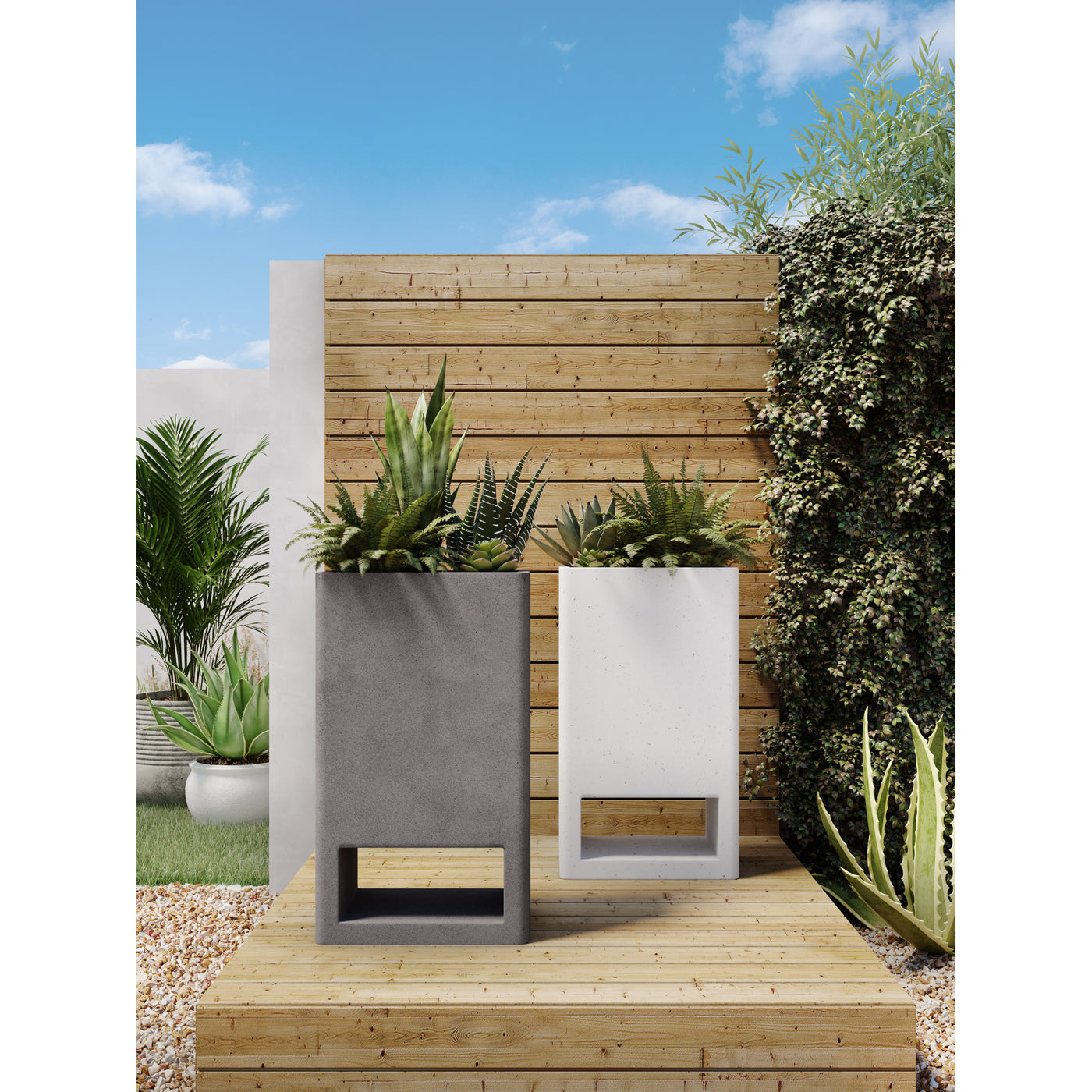 A sculptural planter to blend in seamlessly with your outdoor setting. An eye-catching base cutout and tall rectangular fo...