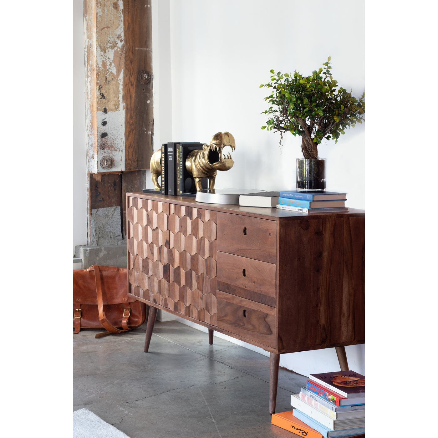 Crafted from solid sheesham wood, the O2 Sideboard has loads of storage in a compact size. The contoured doors add texture...