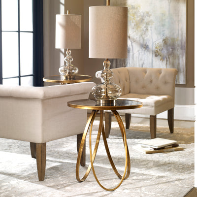 Graceful Loops Of Hand Forged Metal Finished In A Lightly Glazed Gold Leaf With An Antique Mirror Top.