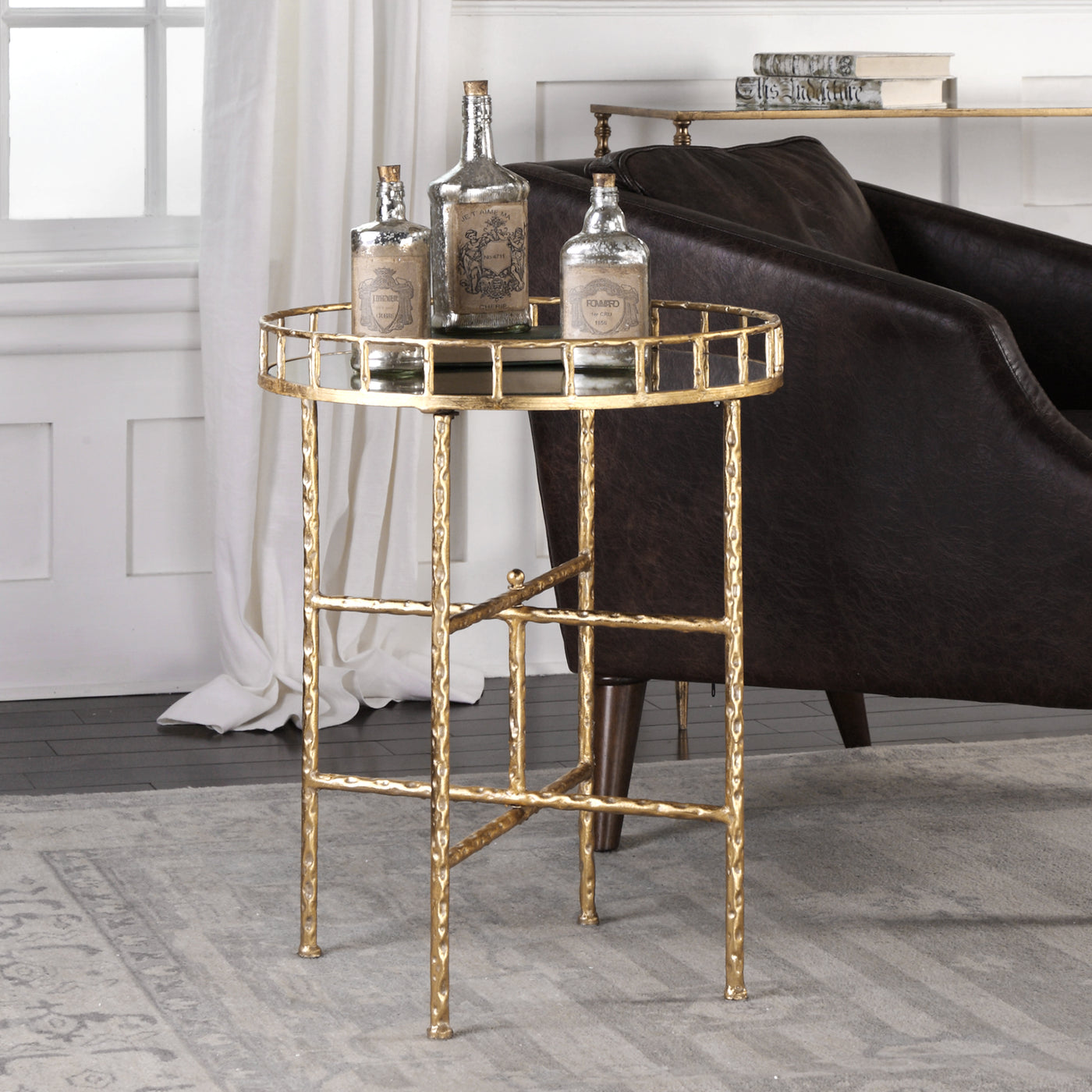 Add A Touch Of Glam With This Accent Table Featuring A Mirrored Tray Styled Top On A Cross Bar Base Finished In Bright Gol...