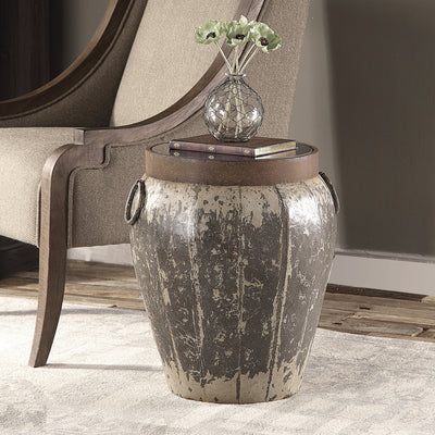 With The Essence Of An Antique Piece, This Metal Drum Table Features A Heavily Aged Rustic Finish In Brown And Ivory Tones...