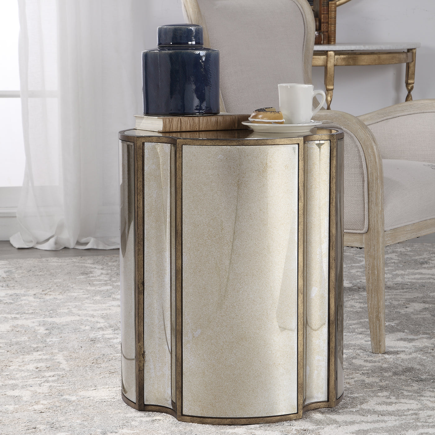 Add Unique Style To A Space With This Quatrefoil Designed Accent Table. Each Facet Features A Curved Antique Mirror Surrou...