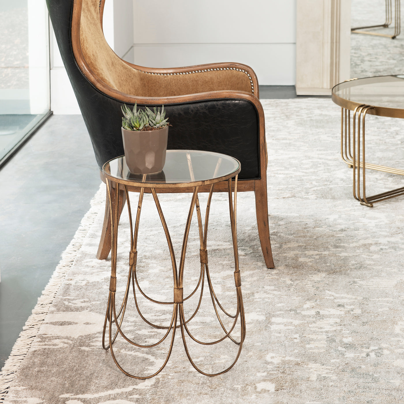 Solidly Constructed From Hand Forged Iron, This Accent Table Showcases Elegantly Curved Lines In An Antique Gold Finish Wi...