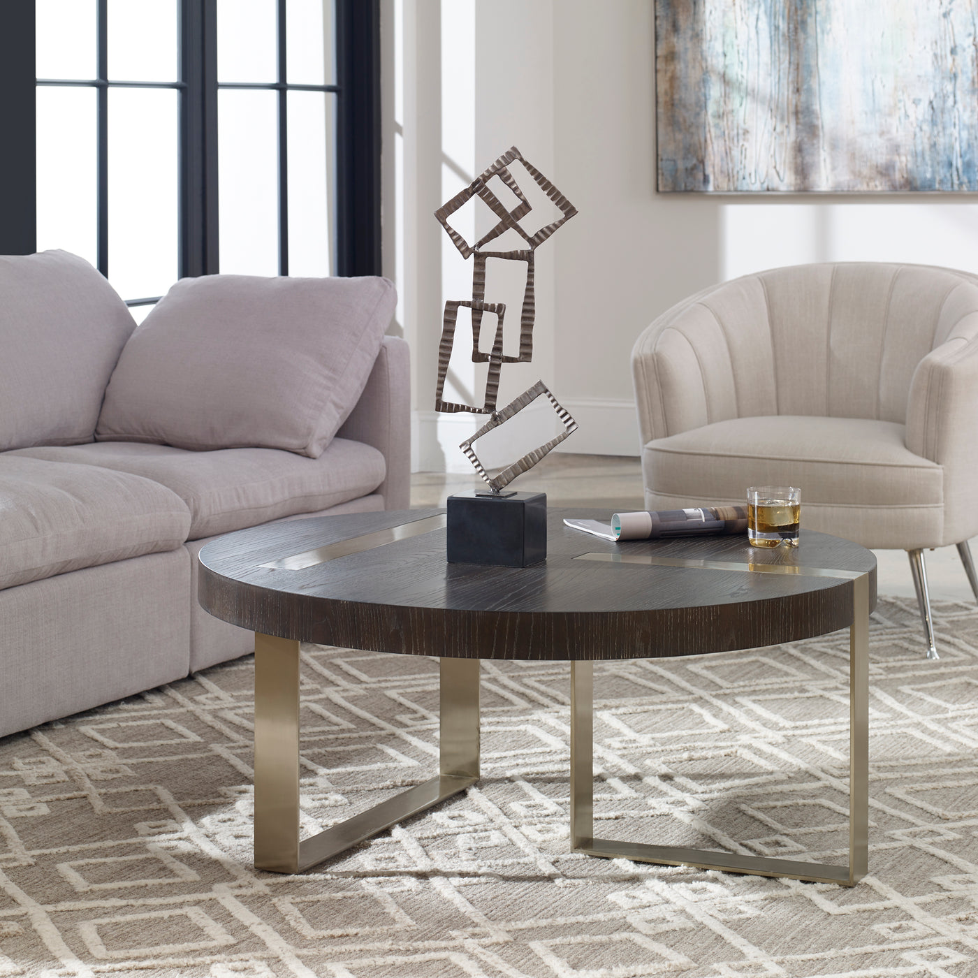 Sleek And Modern, This Coffee Table Showcases Linear Steel Accents Plated In A Brushed Pewter Accented By A Dry Ebony Fini...