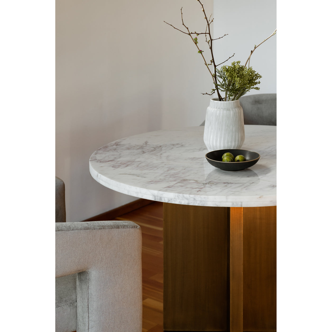 Grace your dining room with the remarkable and contemporary style of the Graze dining table. The sleek white marble top an...