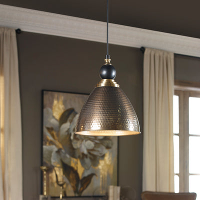 Transitional Pendant Of Hammered Antique Brass Finish On The Metal Shade With A Textured Black Ball Accent Above The Shade...