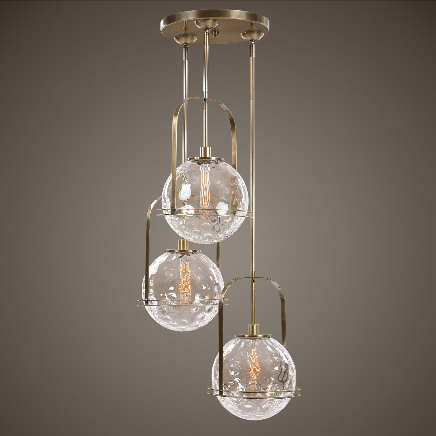 Soft Contemporary Lines Anchor These Oversized Floating Spheres Of Clear Watered Glass All Enhanced With Rich Antique Bras...