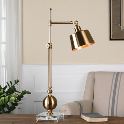 Brushed Brass Plated Metal Accented With A Thick Crystal Foot. The Shade Pivots Up And Down And Lamp Is Also Adjustable In...