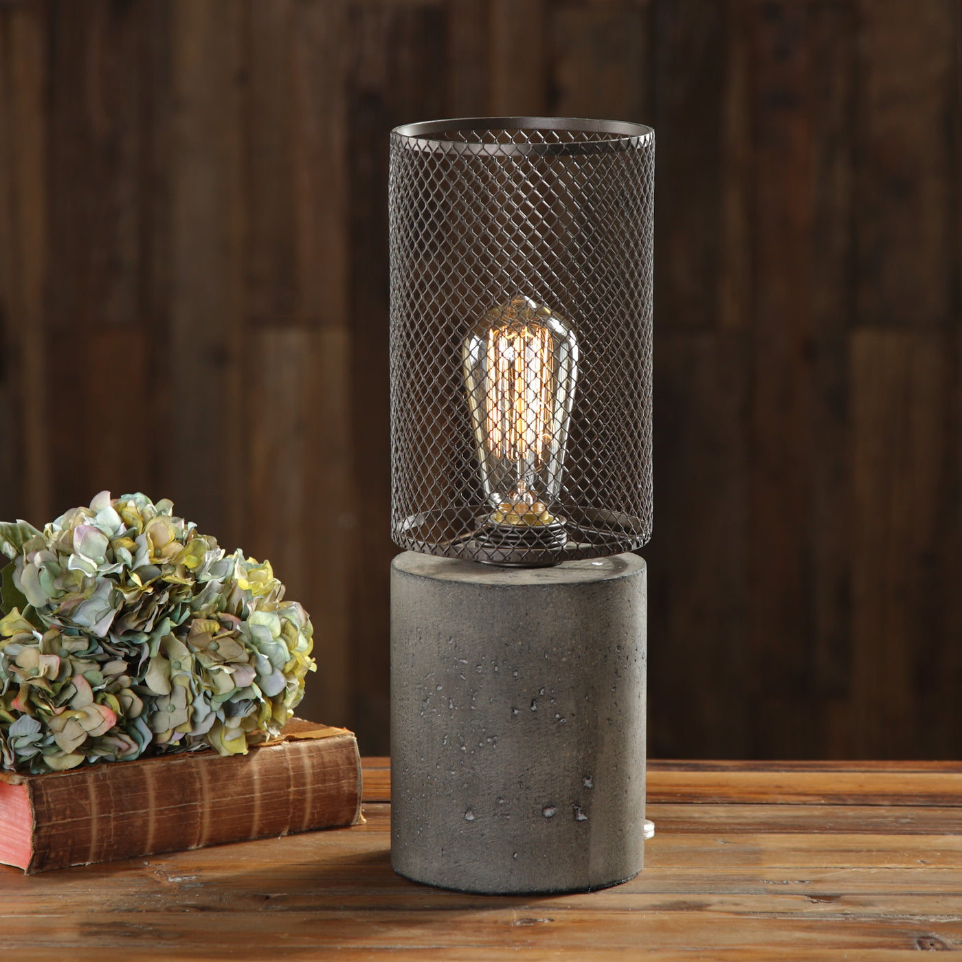 Thick Concrete Column Finished In A Charcoal Stain, Topped With An Industrial Inspired, Rusty Bronze Steel Cage. OIne 60-w...