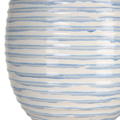 This Ceramic Table Lamp Features An Elegant Fluted Shape With Ribbed Texture Finished In A Soft Blue And White Drip Glaze....