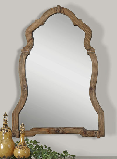 This Ornate Mirror Features A Light, Walnut Stained Wood Frame With Burnished Details.