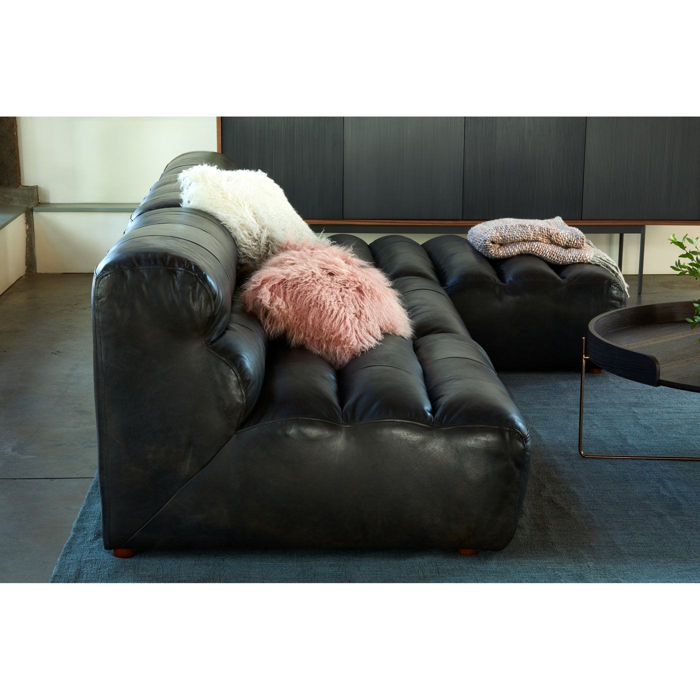 With a low profile and thick cushions, the Ramsay Leather Slipper Chair is the perfect addition to your living room. A sof...