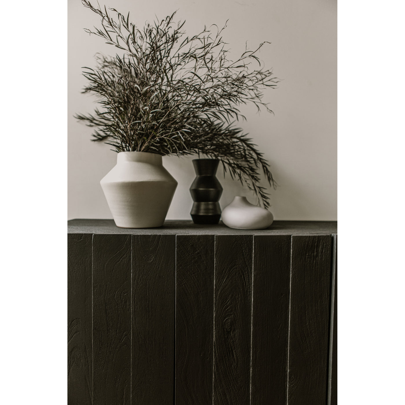 Invite darker hues and decorative introspection into your space with the Brolio collection. Solid, dark-hued mango wood cu...