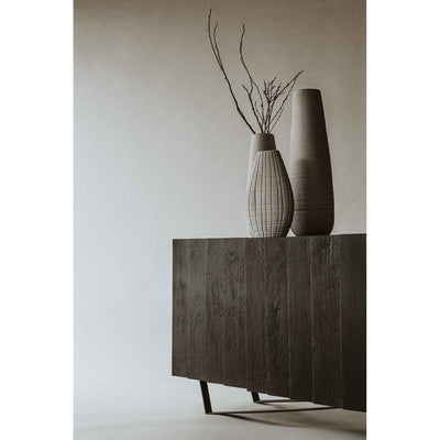 Invite darker hues and decorative introspection into your space with the Brolio collection. Solid, dark-hued mango wood cu...