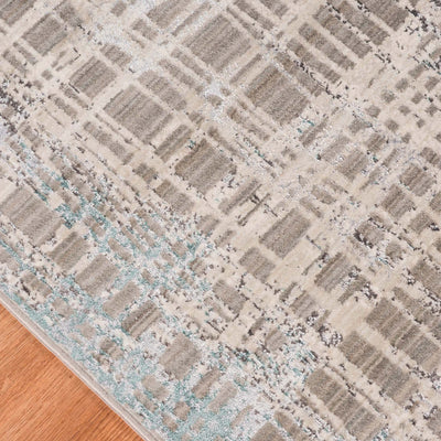 This Power Loomed Rug Features An Abstract Design In Tones Of Polyester Gray, And Beige, With Teal Blue Accents And Hints ...