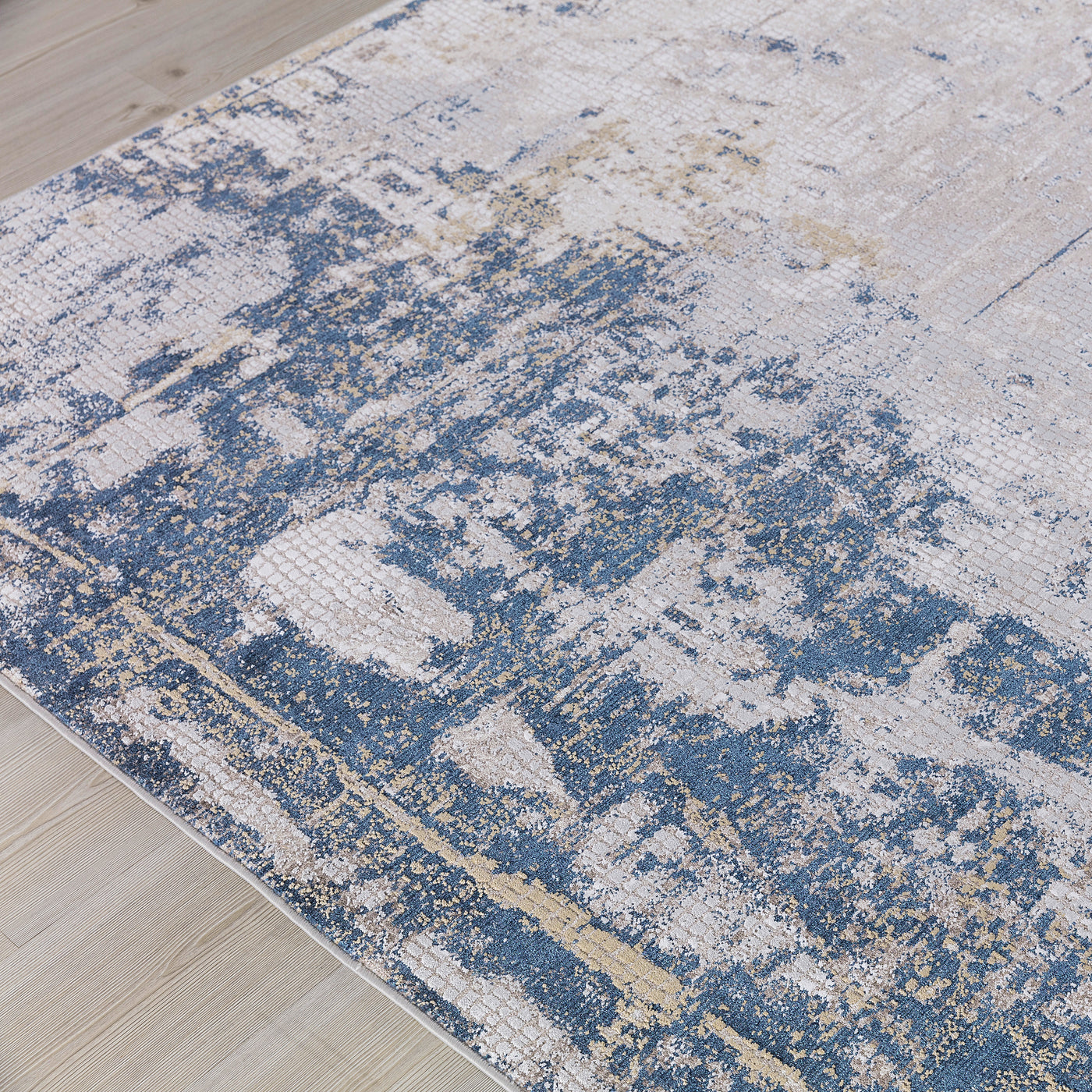 This Power Loomed Rug Features An Abstract Design In Tones Of Beige And Light Gray, With Indigo Blue Detailing, Constructe...