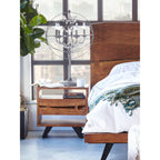 The Madagascar Nightstand is constructed with solid acacia wood on an angular, steel legs to achieve that rustic, industri...