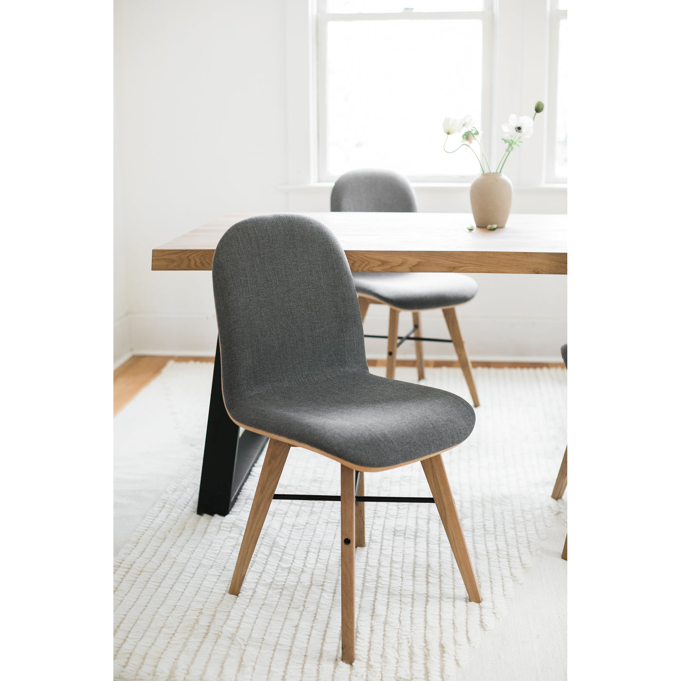 The Napoli is a warm addition to your dining room table or work desk. Upholstered in smooth polyester fabric, it adds a wa...